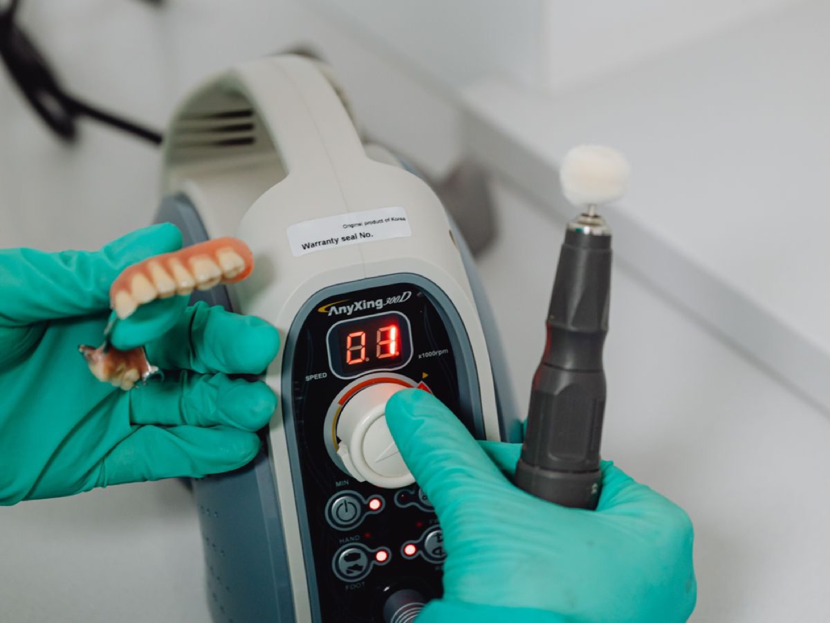 MARS USA Dental Lab technician hand-finishing a restoration